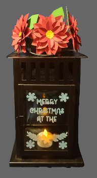 Decorative Christmas lantern with red flowers and 'Merry Christmas at the' text