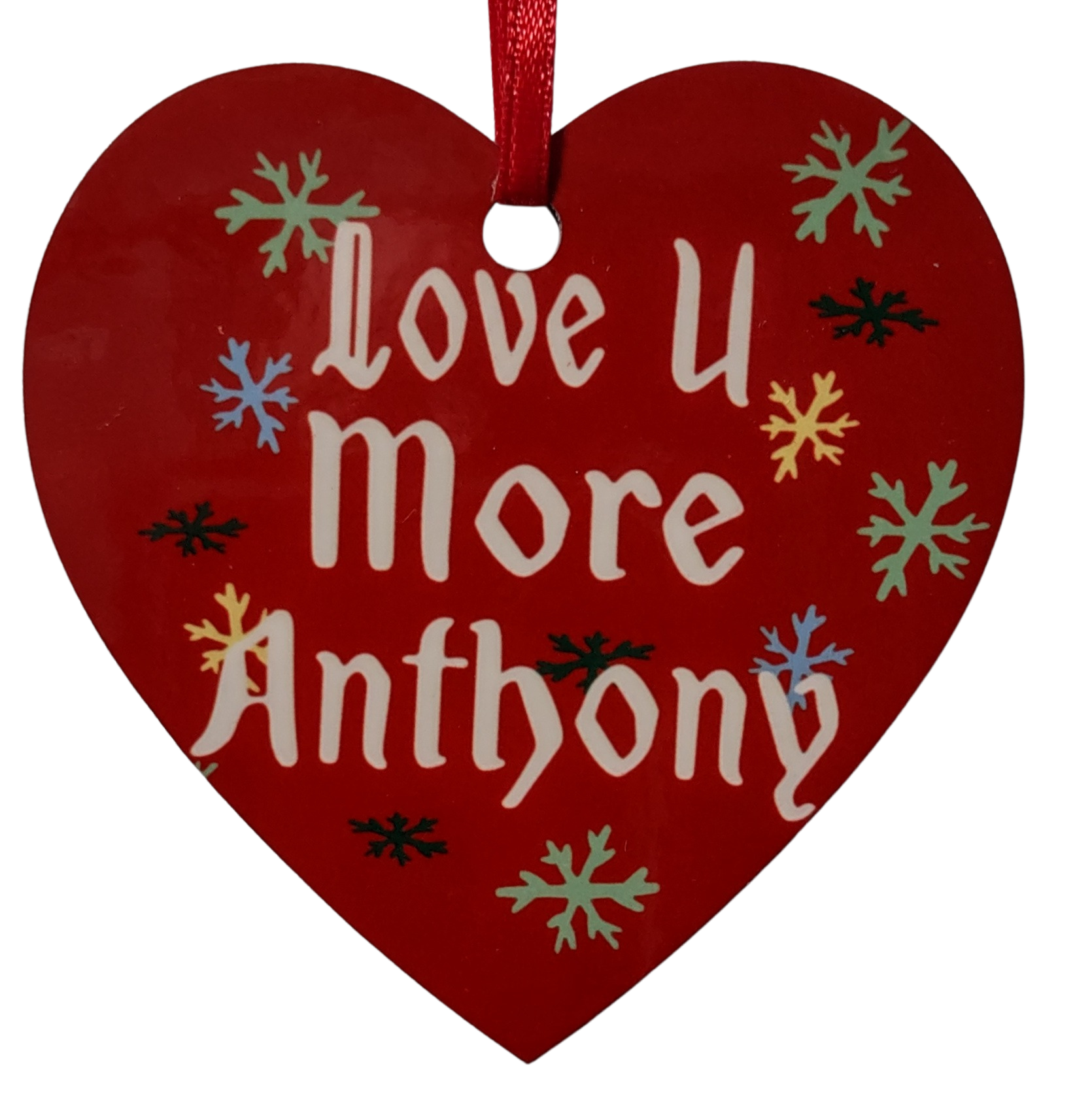 Red heart-shaped ornament with 'Love U More Anthony' text and colorful snowflakes