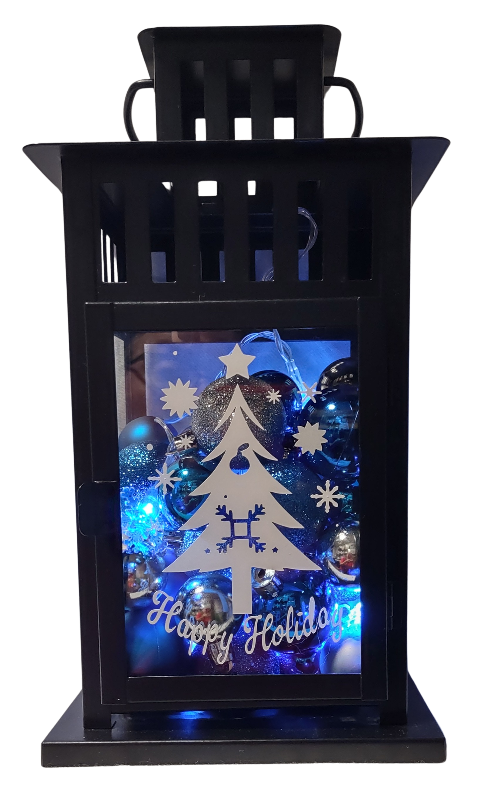 Decorative lantern with Christmas tree design and 'Happy Holidays' text