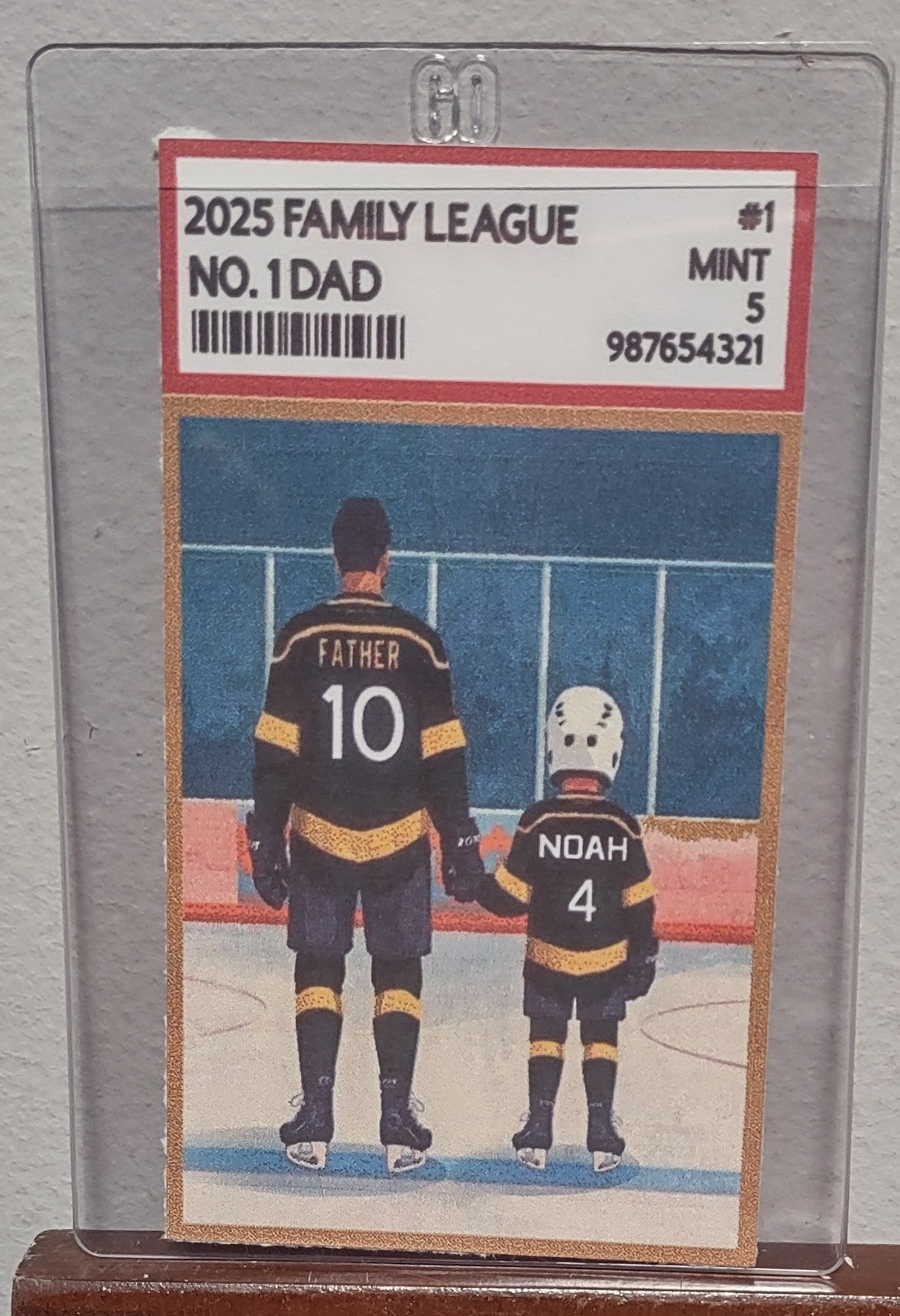 Trading card featuring a father and son hockey players with '2025 Family League No. 1 Dad' text.